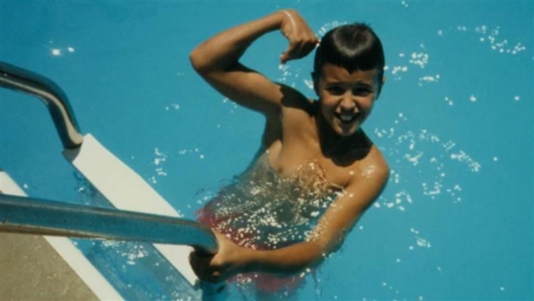 A young Luke Bryan getting wet on vacation.