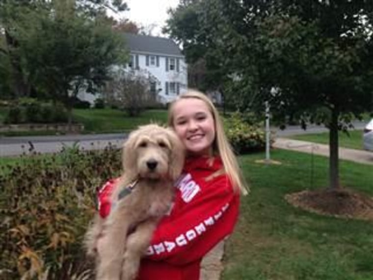 Grace Nazarian, shown with her dog Willow, knows what it's like to be excluded from social events and then have to hear about it via social media.