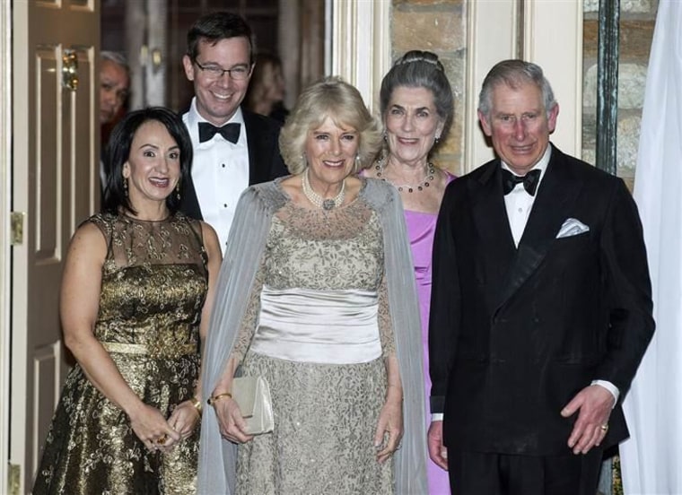Prince Charles, his wife Camilla, the Duchess of Cornwall, and other guests at a Washington reception.