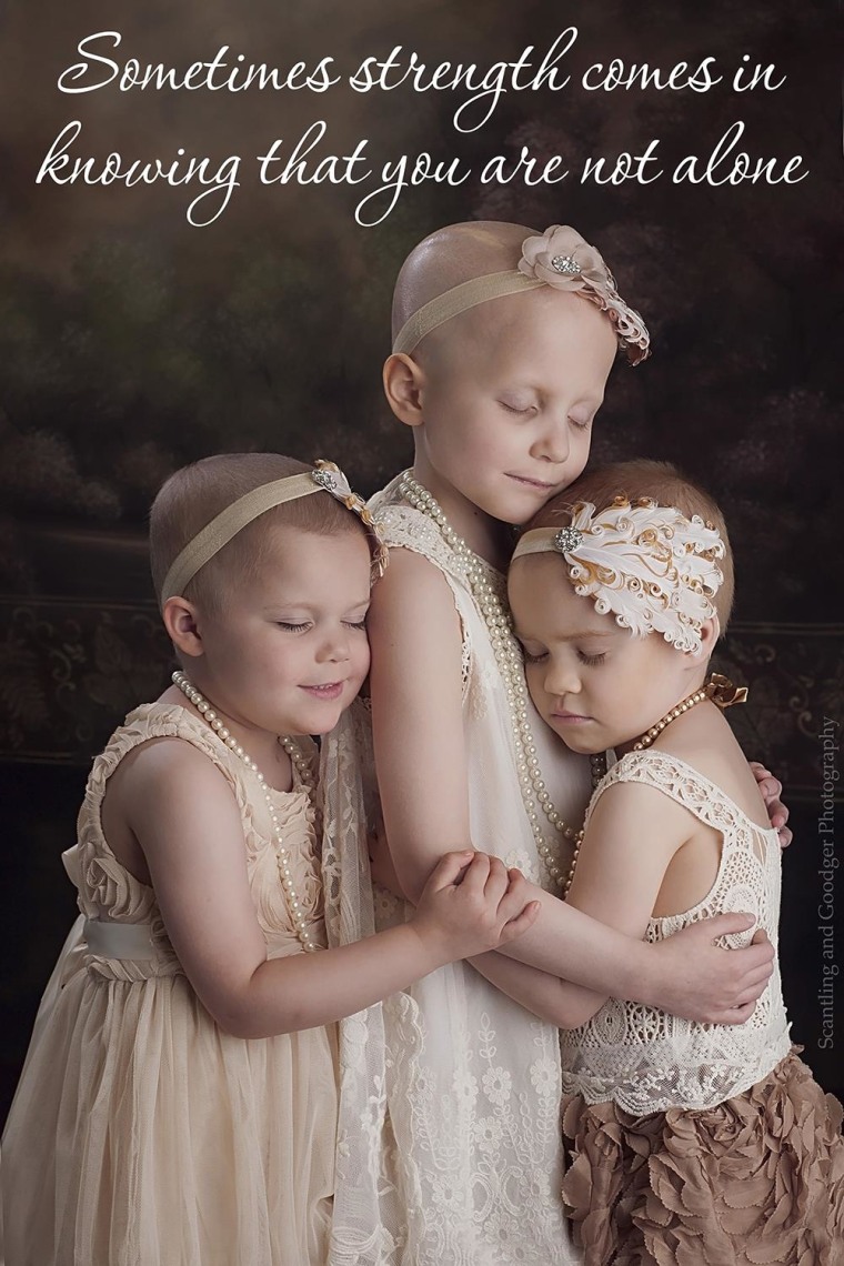 The original photo of the girls that went viral last year during their fight with cancer.