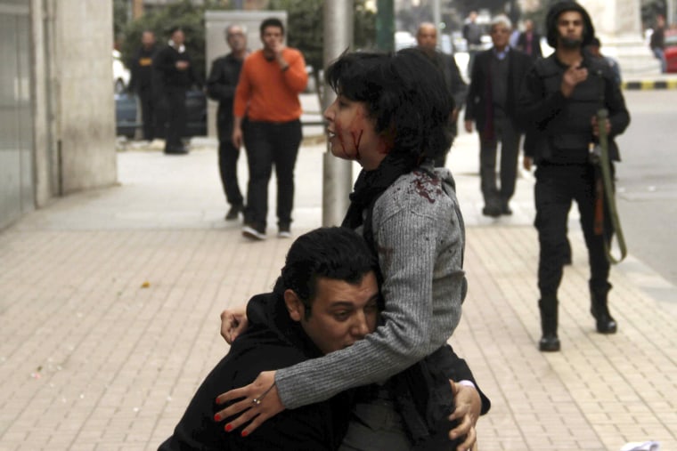 Image: SPAP activist Sabbagh receives help after she was shot during a protest by the party in Cairo