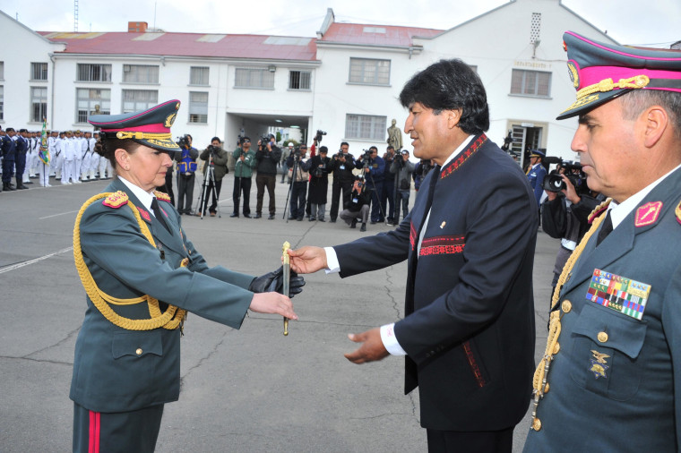 Image: Bolivia's President Evo Morales gives a military baton to newly promoted General Gina Reque Teran during a ceremony in the military headquarters in La Paz
