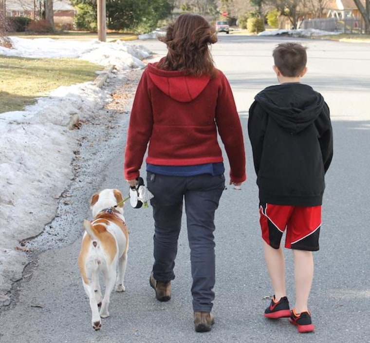 The author walking her son to school. "It’s during the walks to and from school that my son is his most talkative. For instance, a few days ago, we spent a good half-mile debating how it is that a dog—who walks on four legs—could spin out on ice more than a human who walks on two. We still don’t know the answer."