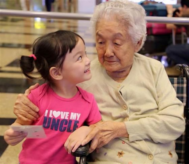 Three-year-old Ruoxian with her great-grandmother Sip Neo Oon, 103