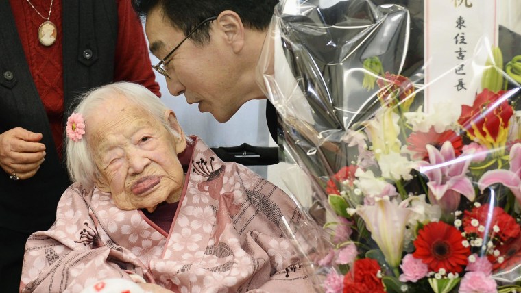 Image: Jpanese Okawa, the world's oldest living person, is celebrated by Ogura, mayor of Osaka's Higashi-Sumiyoshi Ward, at an elder care facility in Osaka