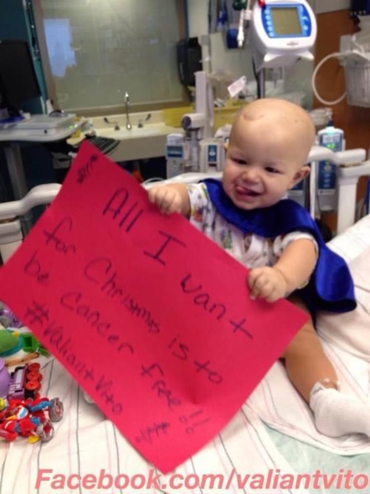 Diagnosed with a brain tumor on Aug. 25, Vito Skaro was photographed four months later in a Superman cape while holding a sign that reads, "All I want for Christmas is to be cancer free!!"