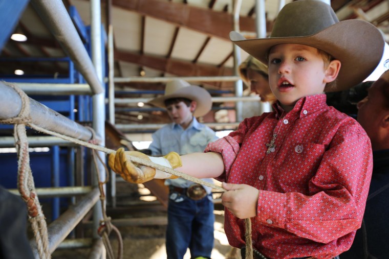 Image: W.K. Seymour, 6, a mutton-buster on the youth rodeo circuit.