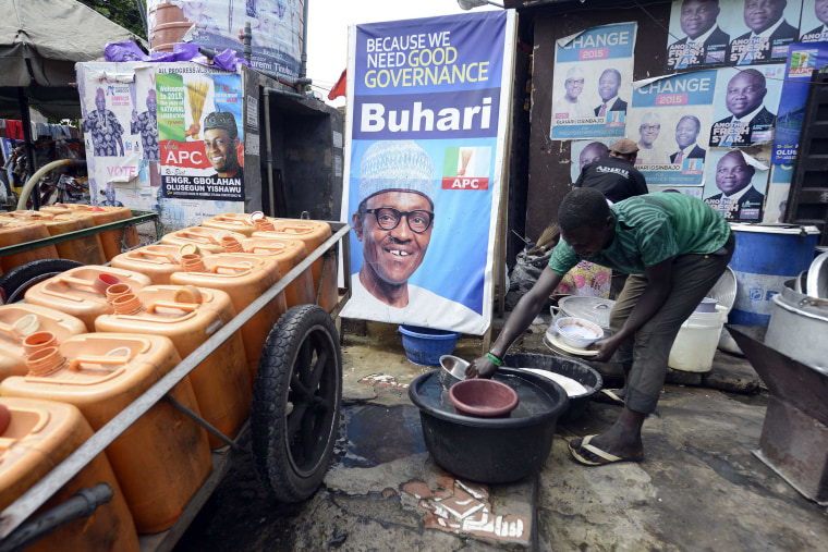 Image: A roadside restaurant features on March 12, a poster of main opposition All Progressives Congress (APC) presidential candidate Mohammadu Buhari in Lagos. Buhari, the 72-year-old candidate of the APC is in neck-and-neck with President Goodluck Jonat