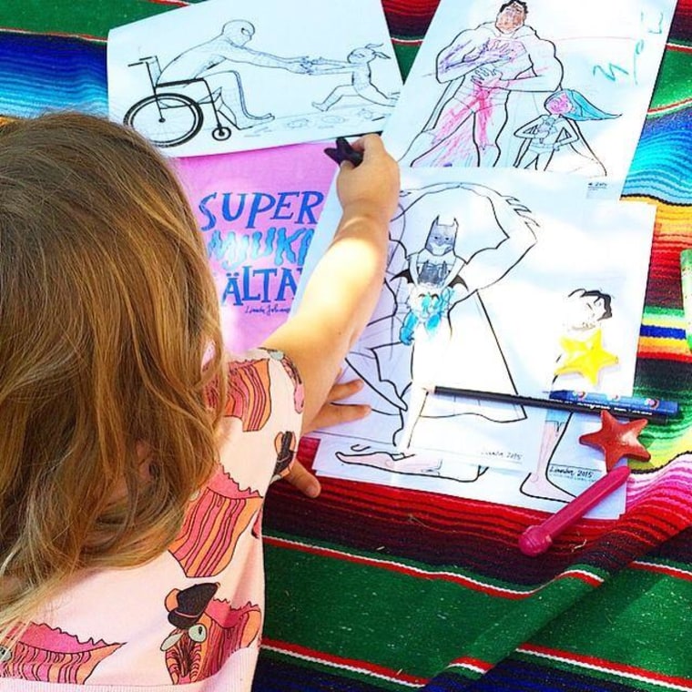 Children color drawings that show everything from Batman wearing a baby to Spider-Man in a wheelchair.