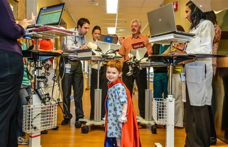 Daniel, a patient at Cincinnati Children’s, joins caregivers on rounds.