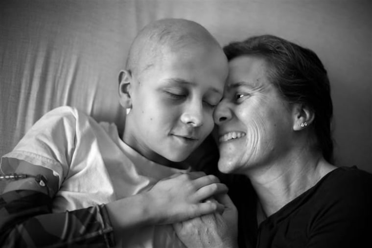 Eleven-year old Jaxson hugs his mother on his first day back in the hospital. After three and a half years of being cancer free, Jaxson has renewed his fight against neuroblastoma.