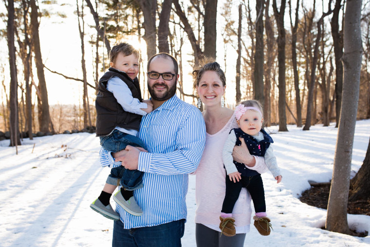 Bobby and Shelly Ross of Hamilton, Massachusetts, hold their two children: son Chale, 2, and daughter Luelle, 1. The baby girl had fetal surgery after being diagnosed with spina bifida.