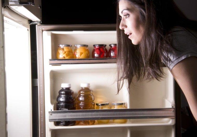 Searching through the refrigerator