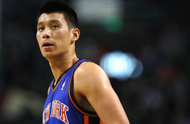 Image: File photo of New York Knicks' Lin watching a teammate's foul shot in the first half of their NBA basketball game against the Boston Celtics in Boston