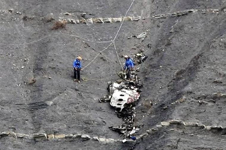 Image: Rescue workers are seen at the crash site of the Germanwings Airbus A320, near Seyne-les-Alpes