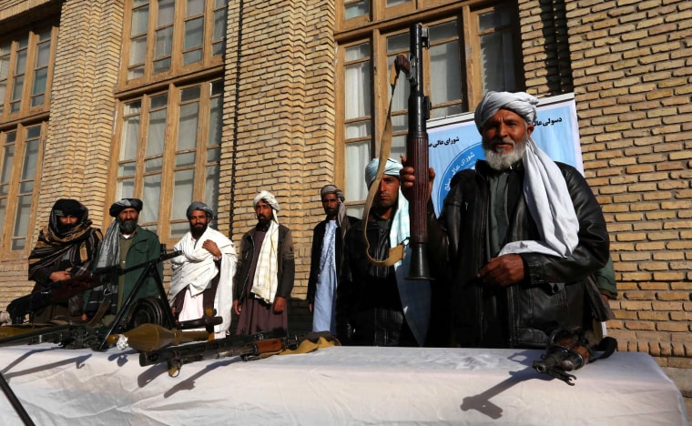 Image: Former Taliban militants surrender as part of reconciliation initiative