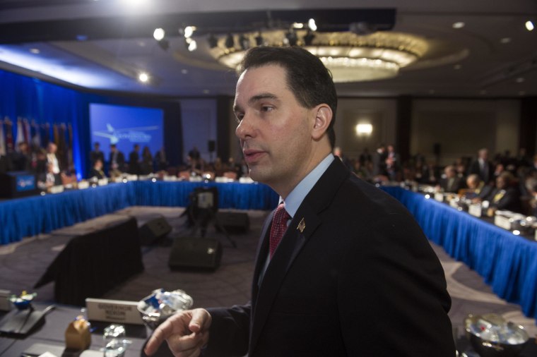 Wisconsin Gov. Scott Walker participates in the opening session of the National Governors Winter Meeting in Washington, Saturday, Feb. 21, 2015. (AP Photo/Cliff Owen)