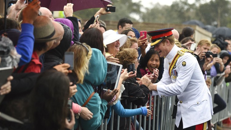 Britain's Prince Harry shakes hands with members of the public during a visit to the Australian War Memorial in Canberra