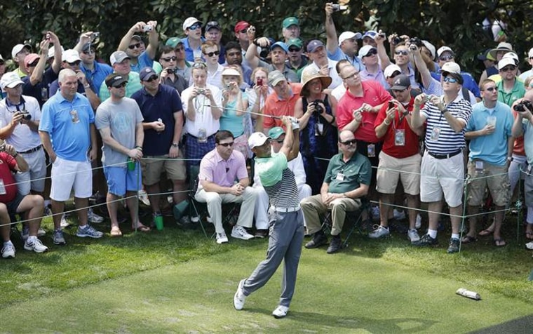 Tiger Woods  hits his tee shot on the sixteenth hole during the final practice round at the 2015 Masters Tournament at the August...