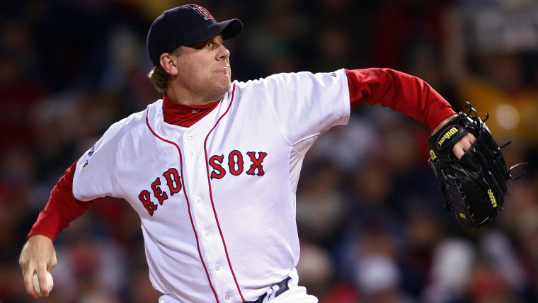 Curt Schilling #38 of the Boston Red Sox pitches against the Colorado Rockies