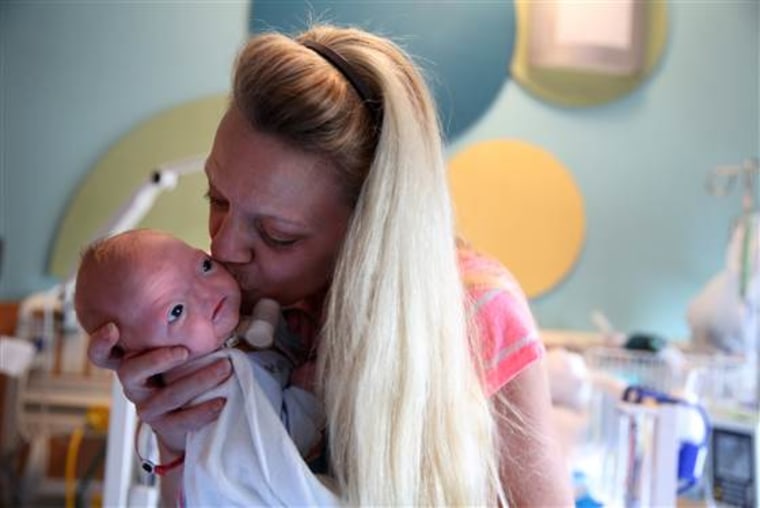 Norma Mayzes holds her grandson Eli.