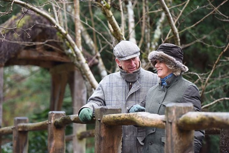 The Prince of Wales and the Duchess of Cornwall in their garden at Birkhall in Scot...