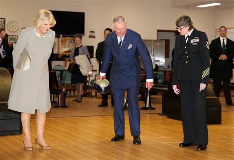 WASHINGTON, DC - MARCH 19:  Camilla, Duchess of Cornwall looks on as Prince Charles, Prince of Wales bowls as he visits the Armed Forces Retirement ho...