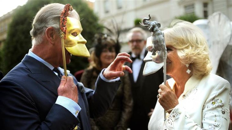 LONDON, UNITED KINGDOM - JULY 09:  Prince Charles, Prince of Wales and Camilla, Duchess of Cornwall pose with masks as they host a reception for the E...