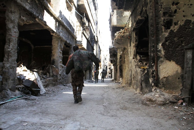 Image: Destroyed buildings in Yarmouk refugee camp in Syria