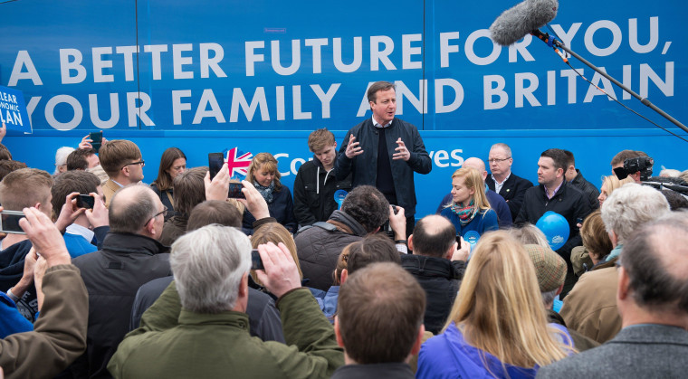 Image: Prime Minister David Cameron talks to supporters on April 4