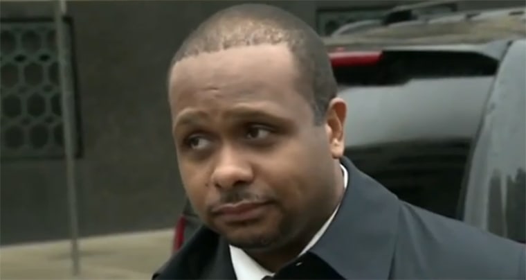 Detroit police officer David Hansberry leaves court on April 9. Hansberry is one of two Detroit police officers accused of robbing drug dealers and stealing drugs and money obtained in police searches.