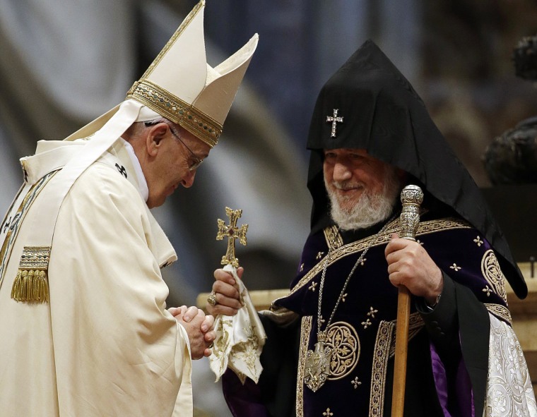 Image: Pope Francis, left, is greeted by the head of Armenia's Orthodox Church Karekin II