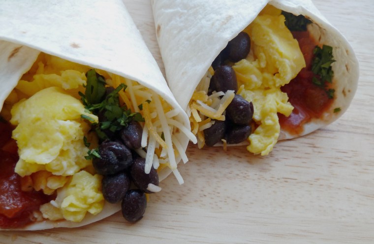 Breakfast burritos with black beans, salsa, cheese and sour cream