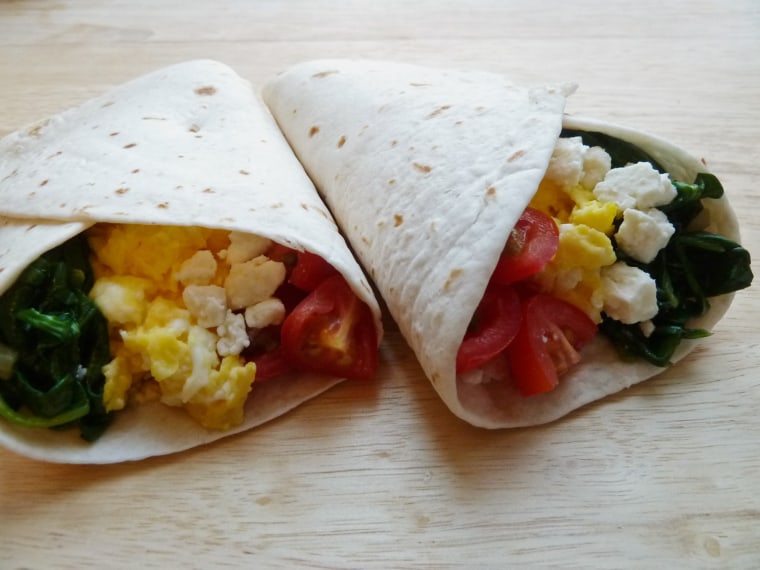 Breakfast burritos with spinach, tomatoes and Feta