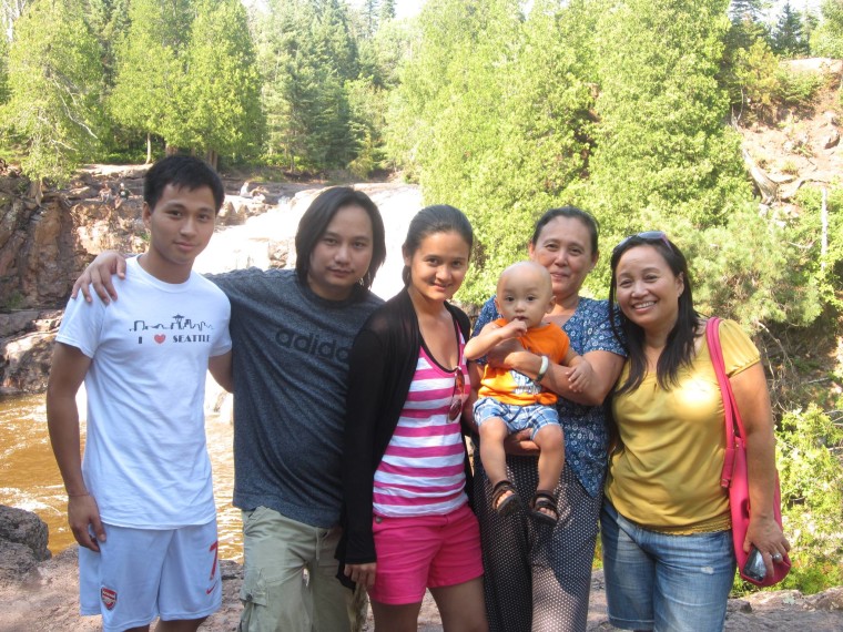 Ta Kwe Say with his mother, brother, sister-in-law and her mother, and nephew in Minnesota.
