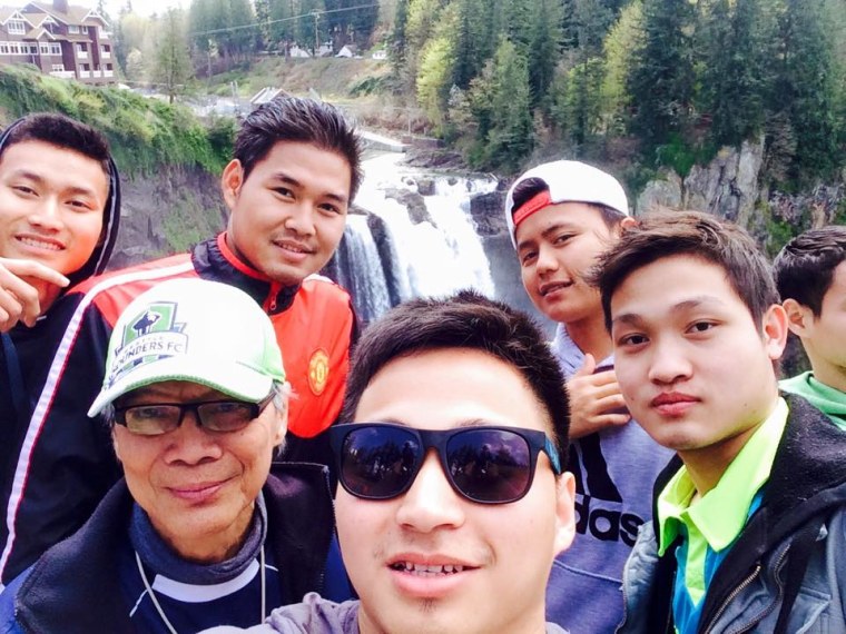 Ta Kwe Say poses with friends in Seattle, Washington.