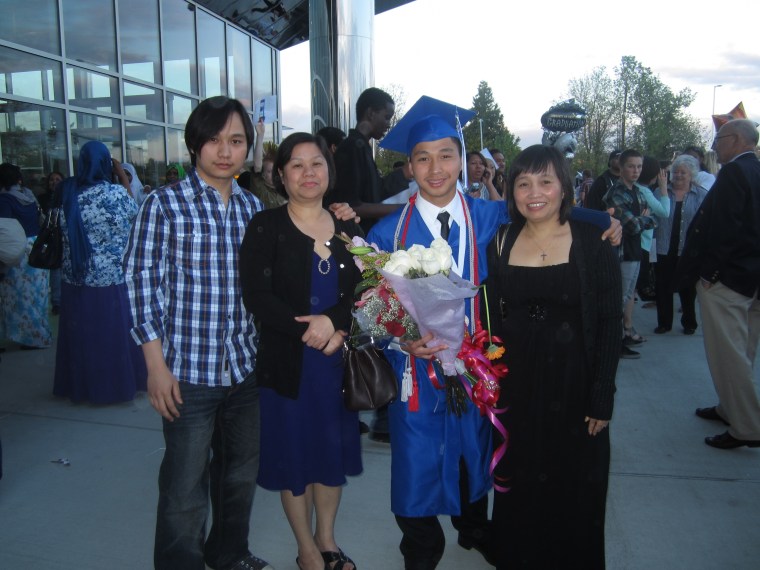 Ta Kwe Say with his family at his high school graduation in Kent, Washington.