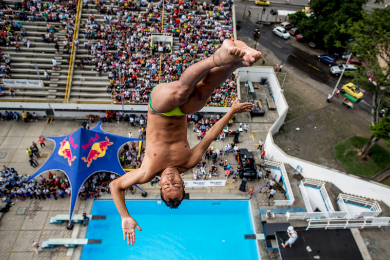 Image: Jucelino Junior of Brazil dives from the 27-meter platform