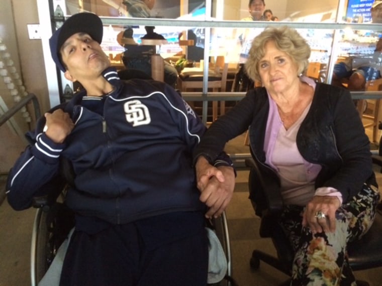 Image:  Matt LaChappa sits with Priscilla Oppenheimer, the longtime director of minor league operations for the San Diego Padres.