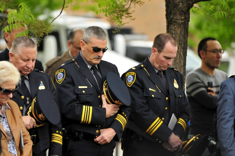 Image: Oklahoma City police officers observe a moment of silence during the 20th Remembrance Ceremony at the Oklahoma City National Memorial and Museum in Oklahoma City
