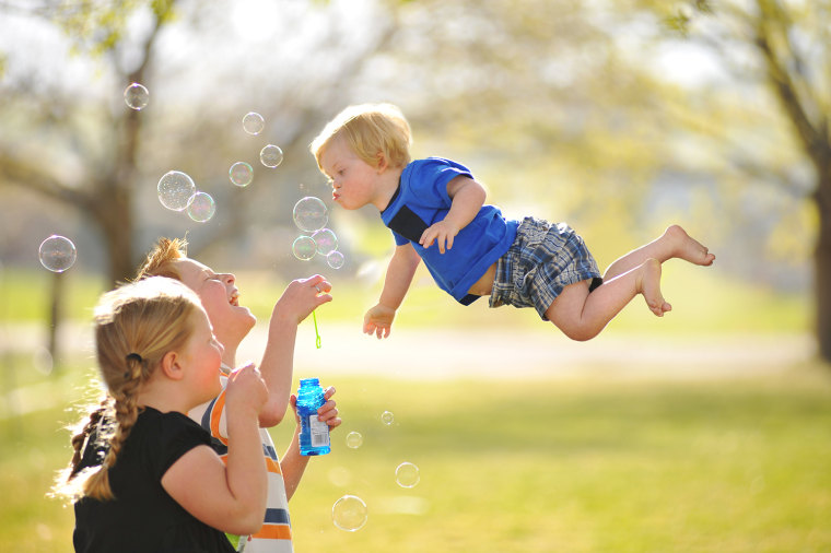 Image: Boy looks like he's flying in photo series