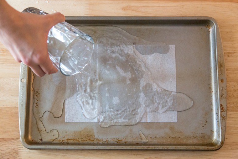 Spring cleaning hacks - use a dryer sheet to clean the stains off a baking sheet