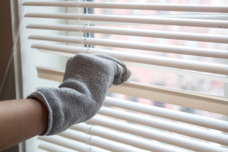 Spring cleaning hacks - dust your blinds with an old sock