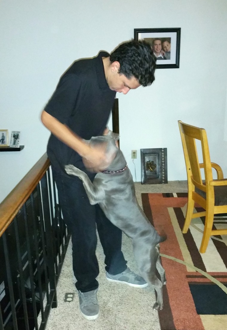 Joey plays with his dog Roxy