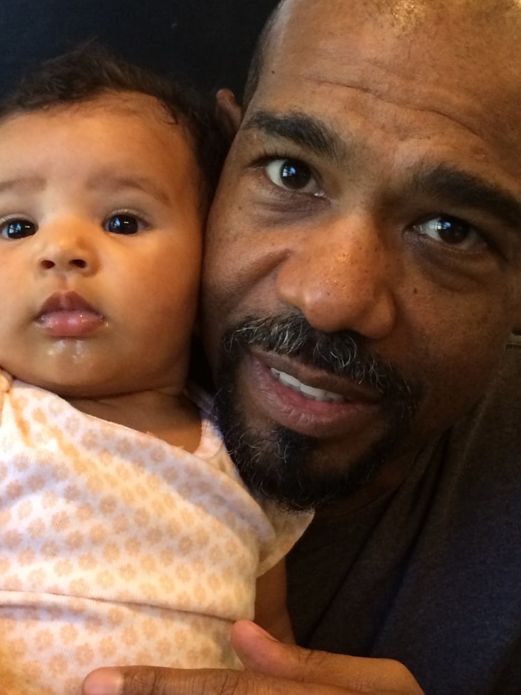 Actor Mike Beach defended his wife after she was criticized for posting a photo of her breast-feeding their daughter while doing her business (or trying to) on the potty.
