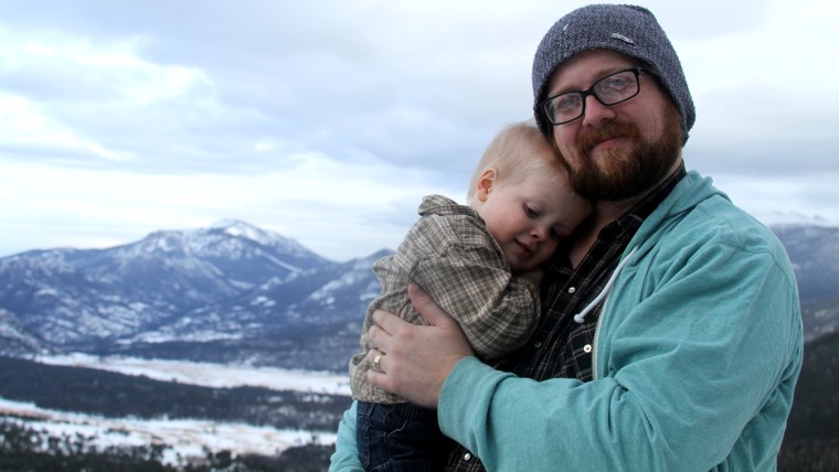 Ryan Green holds his son Joel. Last year, Joel died of brain cancer.