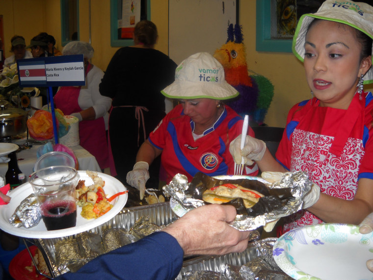 Maria Rivera (left) serves Costa Rican tamales at TamalFest DC on April 19. The event showcased the many varieties of the tamal, a food that dates to precolonial times in Latin America.
