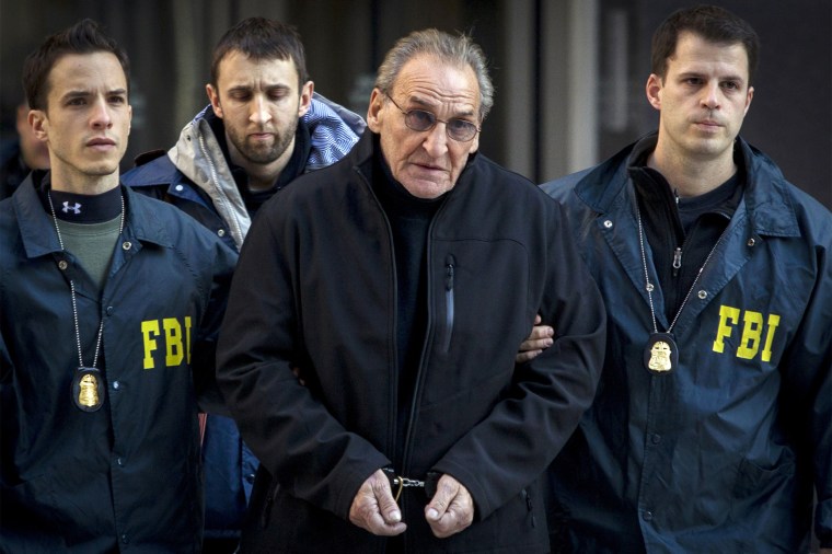 Image: Bonanno crime family leader Vincent Asaro is escorted by FBI agents from their Manhattan offices in New York
