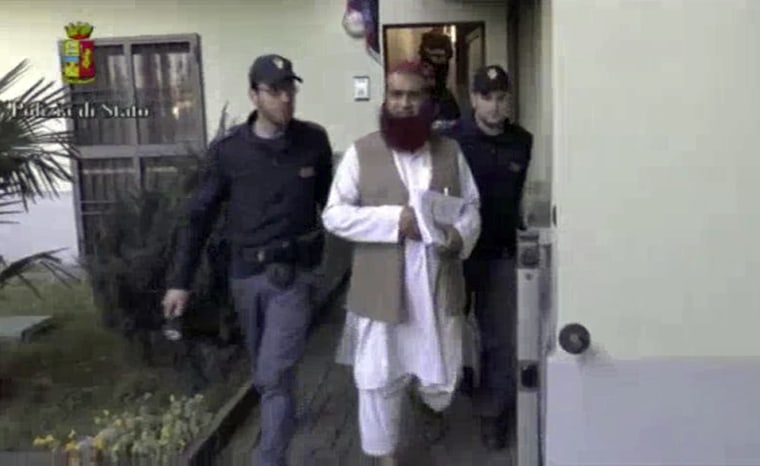 Image: Italian Policemen detain a man suspected to be member of an armed organisation inspired by al Qaeda