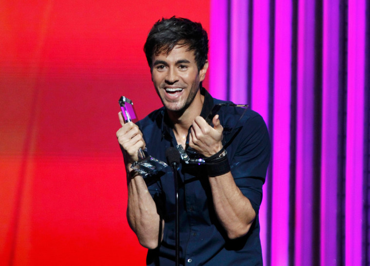 Image: Singer Enrique Iglesias accepts a pair of awards at the 2015 Latin Billboard Awards in Coral Gables